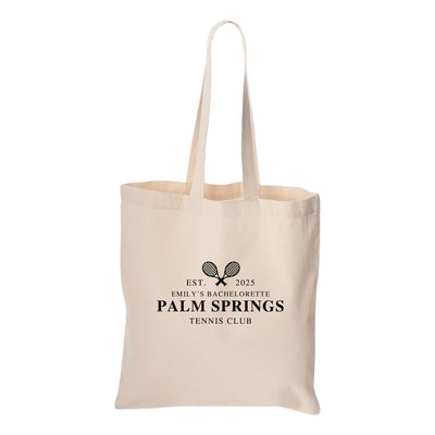a tote bag with the palm springs tennis club logo on it